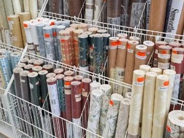 Photo of numerous clearance wallpaper rolls.