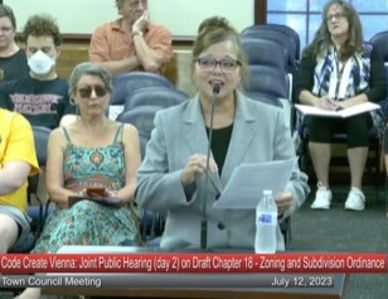 Sharing testimony and data at Vienna Town Council's televised hearing for ordinance revisions.