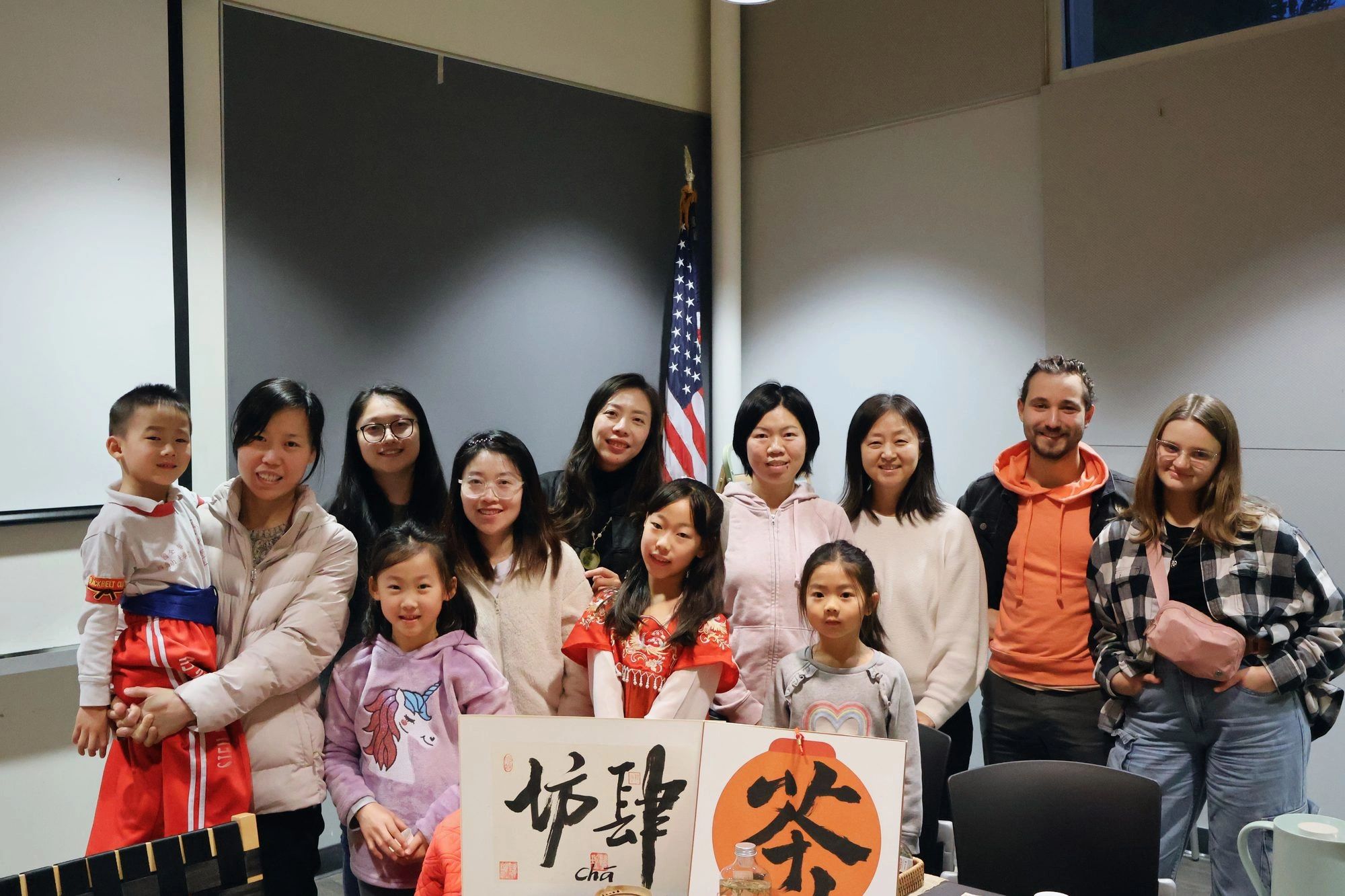 Families and neighbors gathered together after a community tea circle in San José