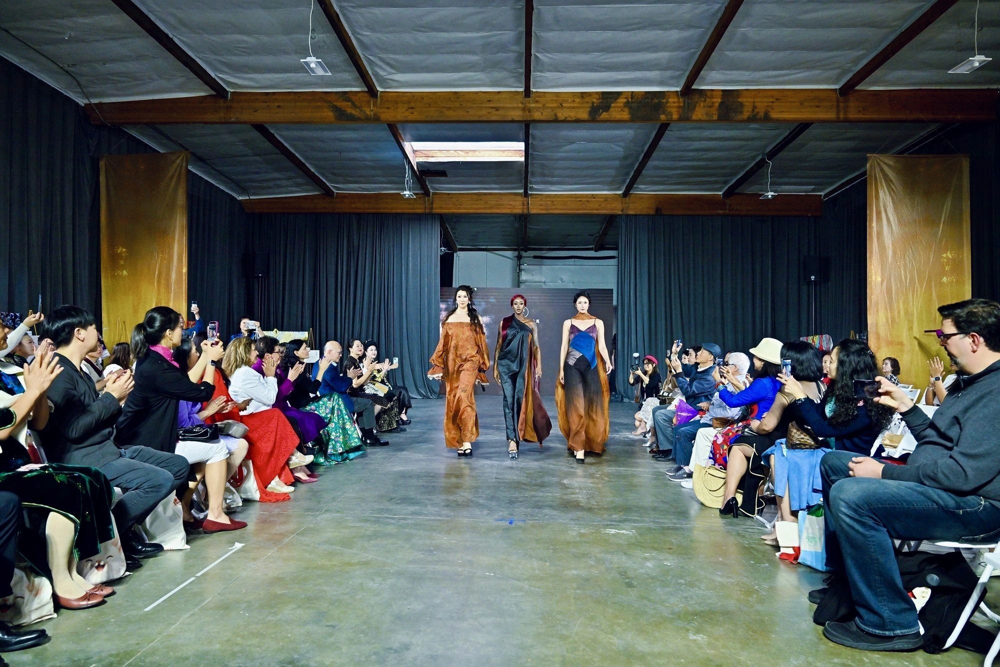 Models presenting garments on the runway at an ACHEA cultural textile presentation