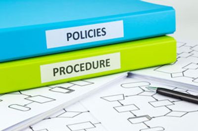 2 notebooks showing policies and procedures