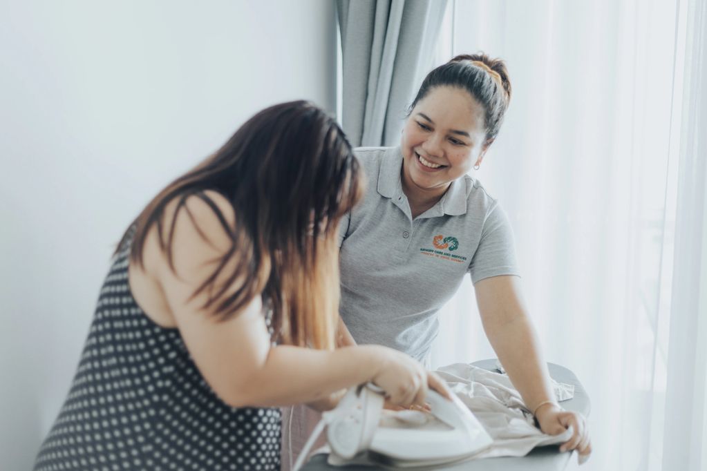 Healthcare worker assisting on a household chore