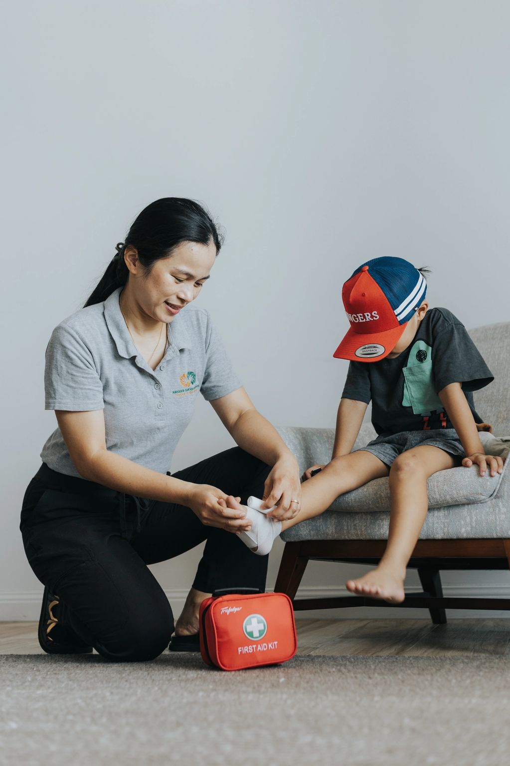 Healthcare worker administering first aid on a child
