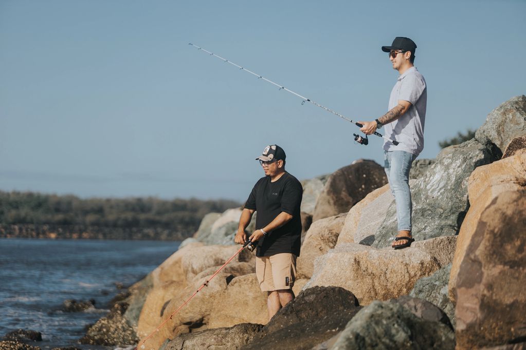 Healthcare with a client fishing by the rocks