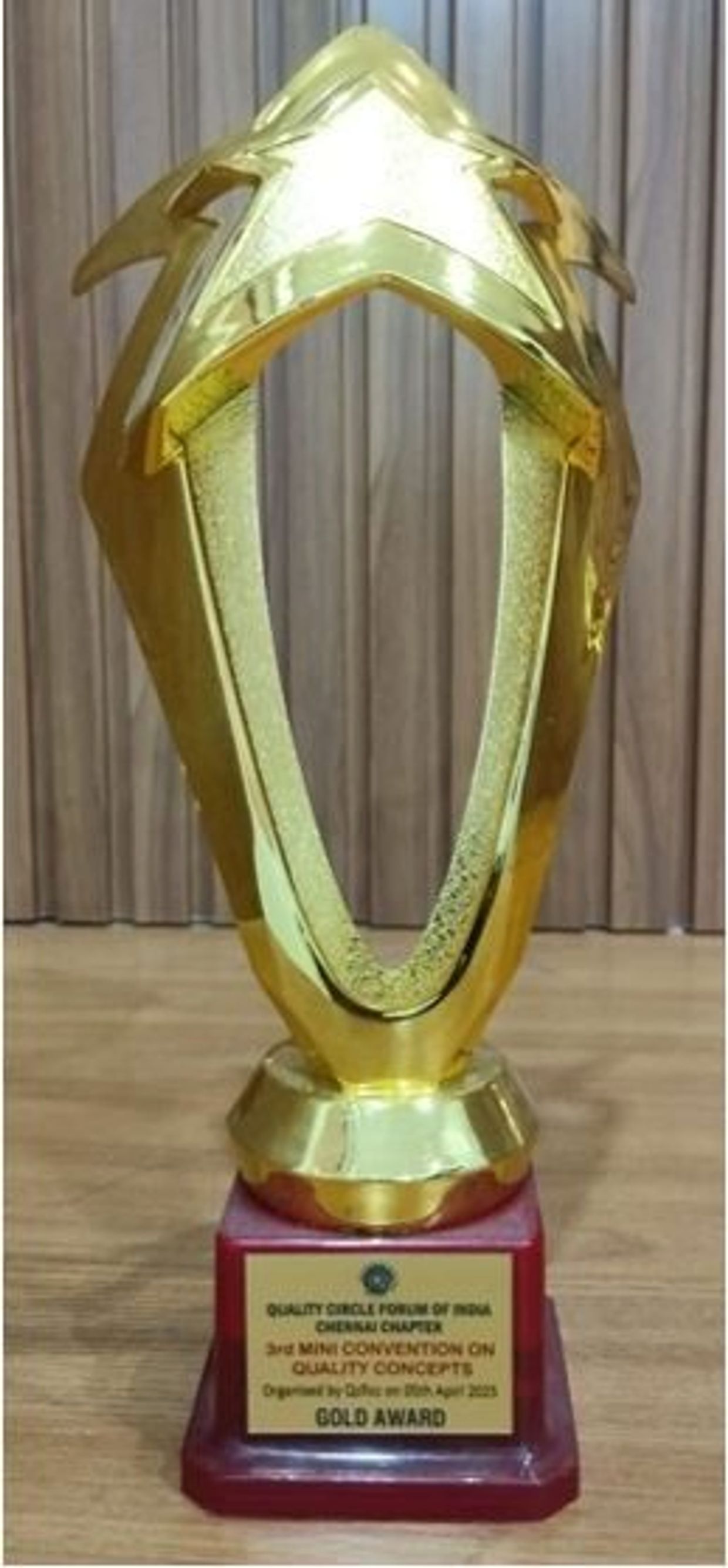 Gold quality award trophy from Quality Circle Forum of India.