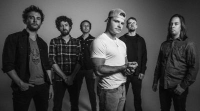 Black and white photo of six men posing together.