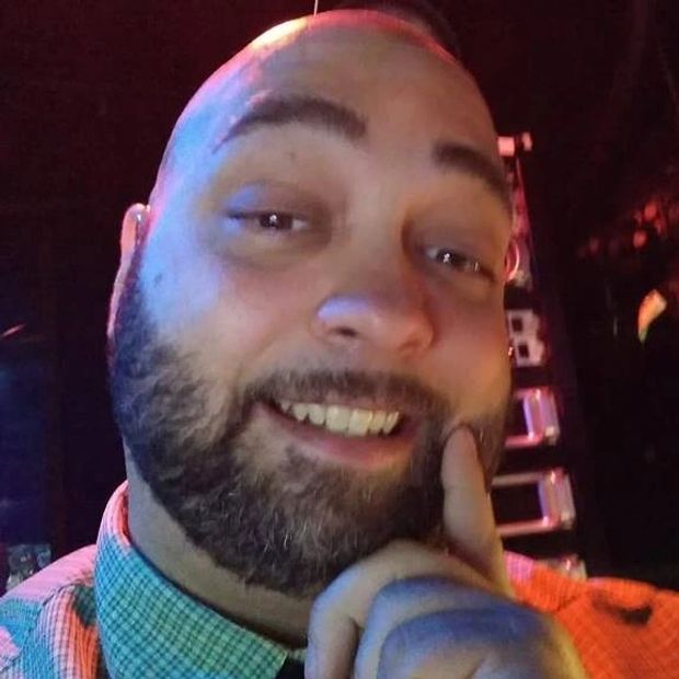 Voice Talent Joshua Lute smiling with a short beard