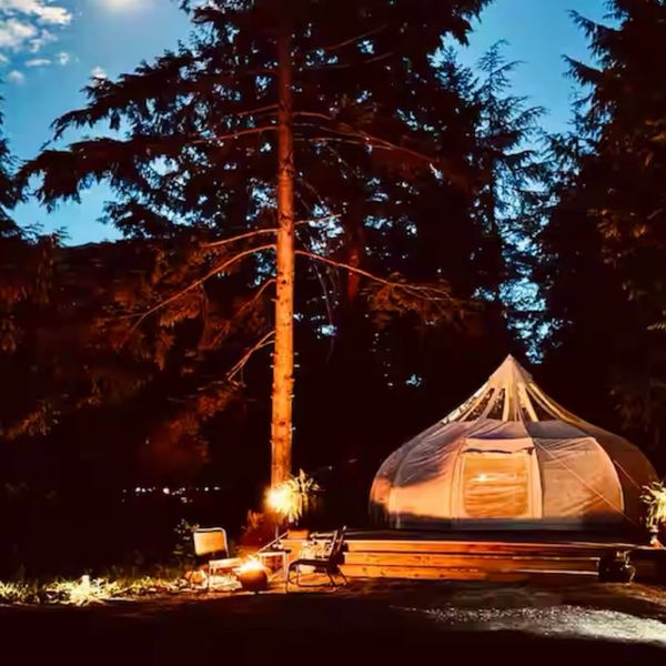 Magical glamping under stars! This cozy tent offers a serene escape with a campfire.