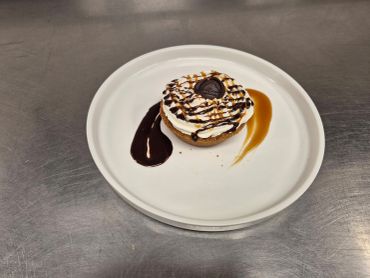 Dessert with whipped cream and sauces.