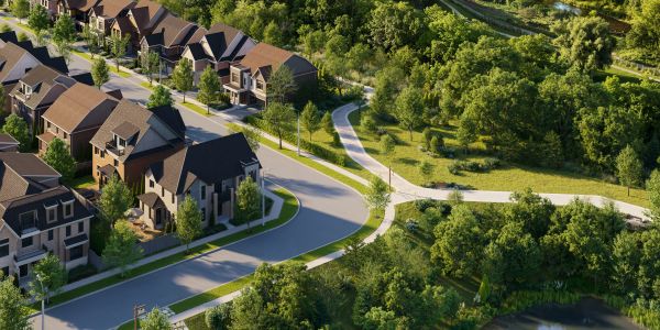A suburban neighborhood next to a lush green park.