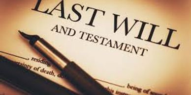 A pen resting on a last will and testament document.