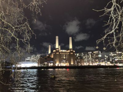 Battersea Power Station Jan 2026 illuminated. An early heat network pumping heat across the river.