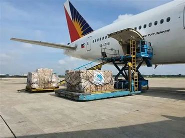 Cargo being loaded onto a Philippine Airlines plane.