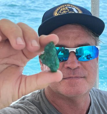Bradley Williamson with the 135-carats raw emerald from the 1715 Treasure Fleet