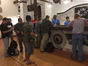 Bradley Williamson with Josh Gates and production team checking into resort after staying on Mona.