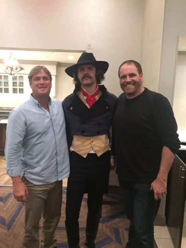 This is a "behind the scenes" photo of Bradley Williamson (blue shirt),