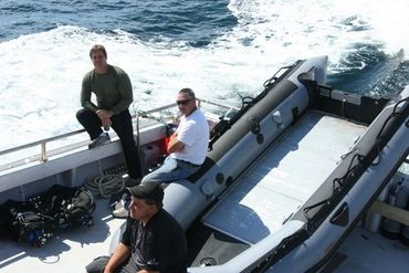 Bradley Williamson on stern of treasure salvage dive boat.