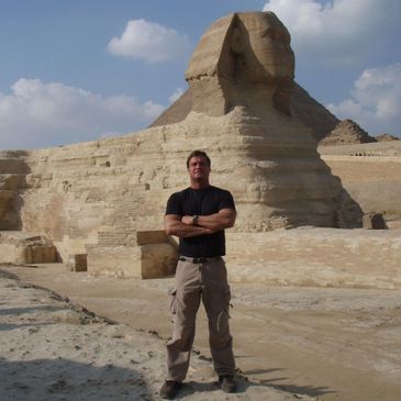 Bradley Williamson in front of the Sphinx and Great Pyramid in Egypt