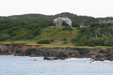 Abandoned mansion on coastline of Canada on st Paul island where I found sunken treasure.