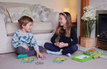 Family time playing the children's board game Funny Fairies