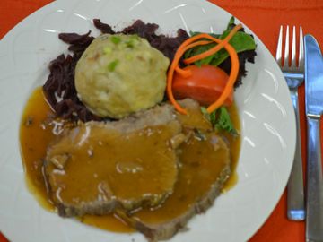 Sauerbraten Bavaria style, served with German bread dumplings or  German potato salad