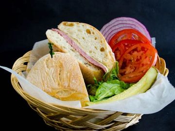 German Salami Sandwich served with  choice of bread, cheese , lettuce tomato, onions, pickles.