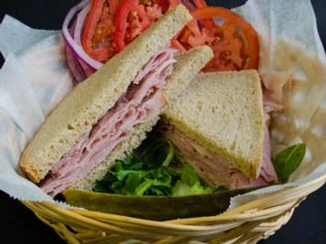 Ham Sandwich with lettuce tomato, onions, mixed greens with sweet or mild german mustard on the side