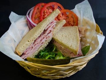 Ham Sandwich with lettuce tomato, onions, mixed greens with sweet or mild german mustard on the side