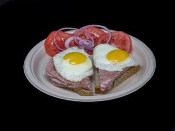 Leberkaesse ( German Meatloaf) Breakfast on Rye bread with Sunny Side Up Eggs