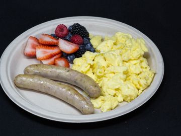 Nurnberger breakfast with scramble eggs and fruit cup