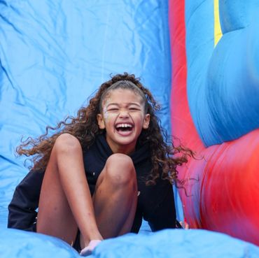 Happy kids sliding n our inflatable slide. Inflatable rentals in Charlotte, NC