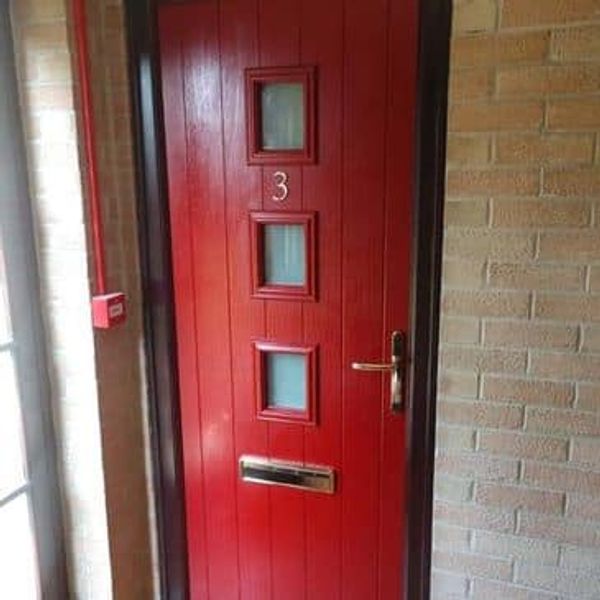 Red Fd30 Composite Fire Door with a Rosewood frame and Satin Pyrodur glass fitted in Nottinghamshire