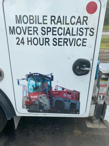 Sign on vehicle advertising 24-hour mobile railcar mover specialists.