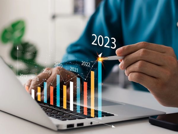 Businessman analyzes profitability of working companies with digital augmented reality graphics,