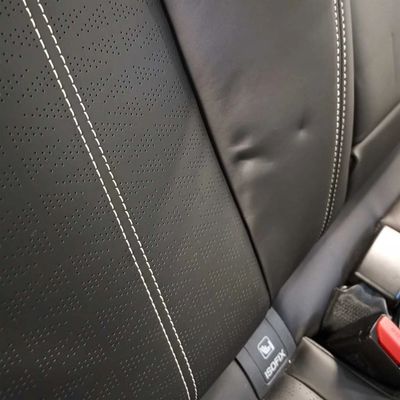 Leather dings, dents and indentations are very common and generally caused by baby seats in cars.