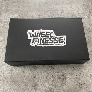 Fitted leather/perforated steering wheel cover from https://wheelfinesse.com/