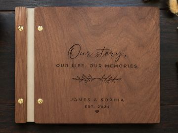 Wooden photo album titled 'Our story, Our life, Our memories' with names James & Sophia.