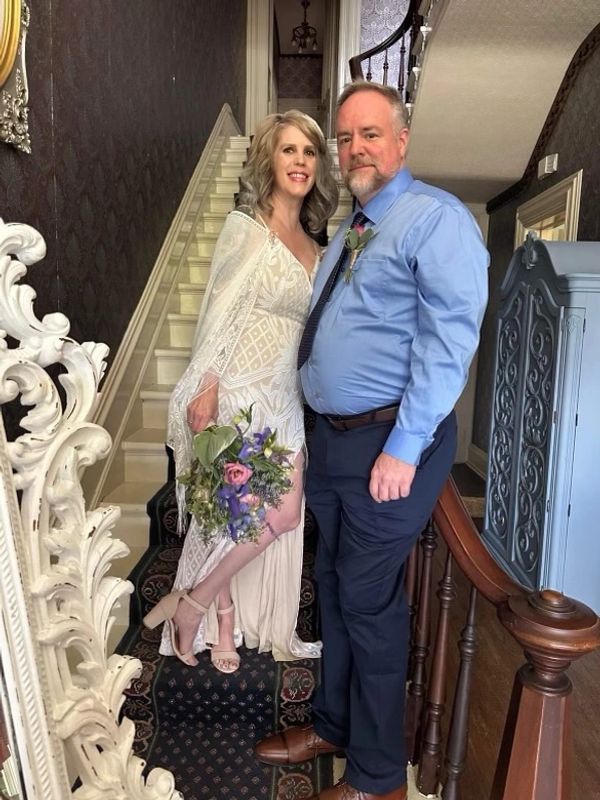A lovely couple posing for a wedding photo