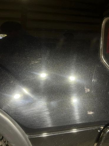 Swirl mark removal during professional paint correction service