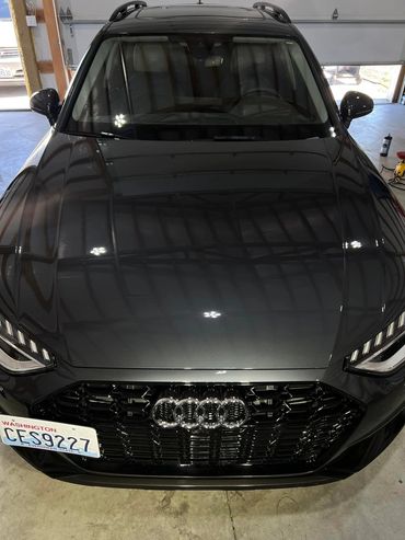 Paint correction removing swirl marks on black car hood