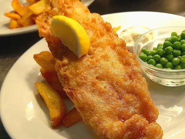 Fish and chips served at a St. Andrew’s celebration catering event in Liverpool.