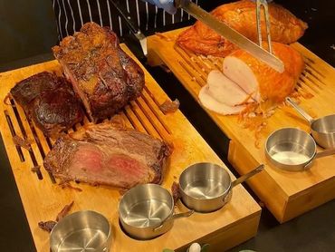 A variety of roast meats served on a catering table for an event in Chester.