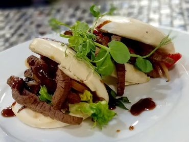 Assorted sandwiches served on a plate at an event in Warrington.