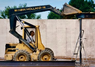 do it yourself DIY construction farm renovation with skid loader