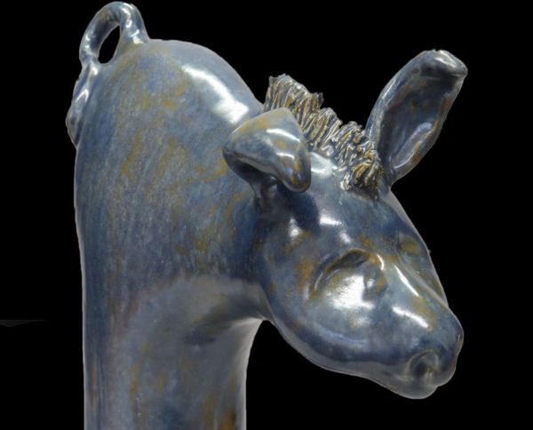 Blue Moon Burro , a minimalist sculpture, exudes peace and tranquility.  This original clay figure w