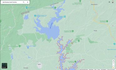 Lake Keowee and Lake Jocassee, South Carolina. Roughly 70-85 miles from Asheville.