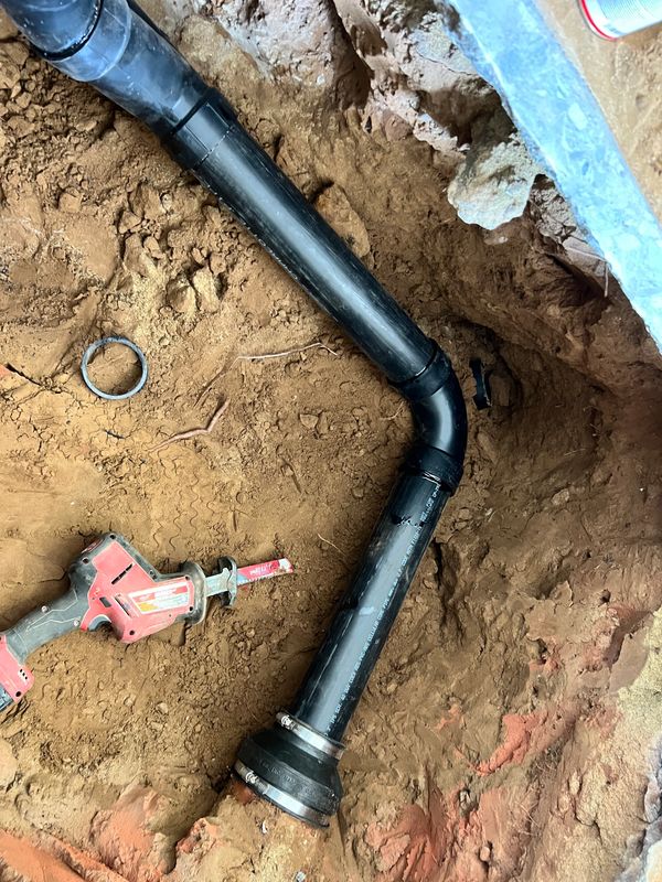 Cleanout installation with small repipe from old cast iron pipe section to abs