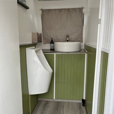 A washroom sink and a towel in the caravan