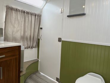 A room with curtains in the caravan