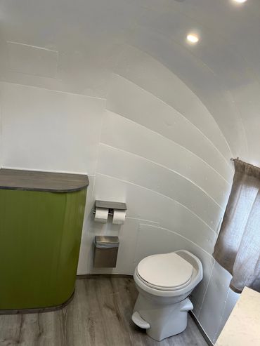 A beautiful washroom and a toilet inside the caravan